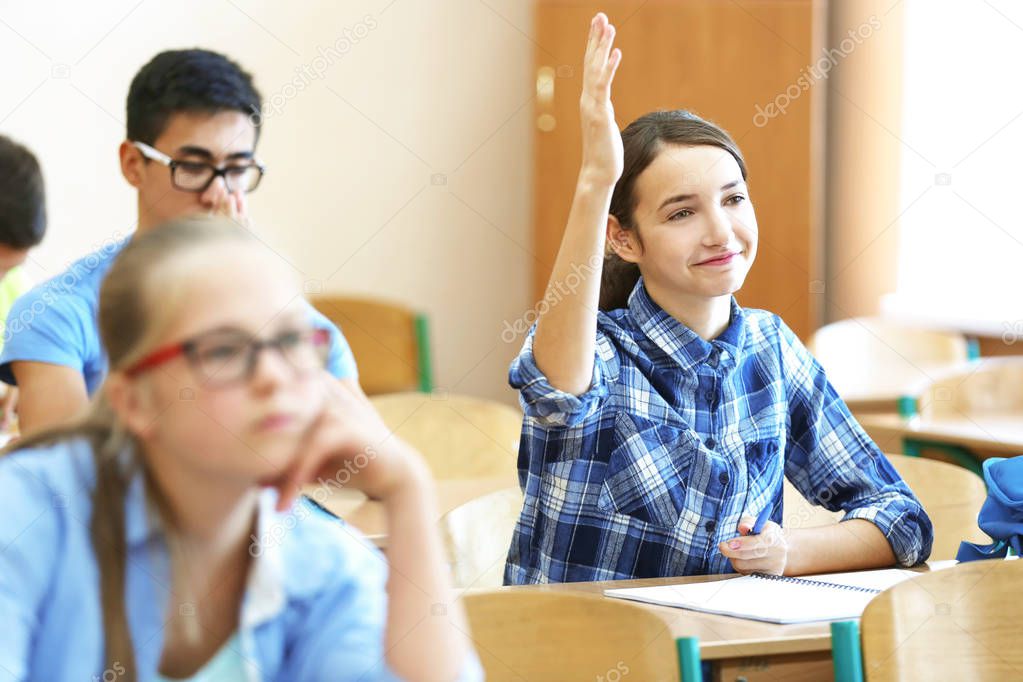 Student with group of classmates in classroom