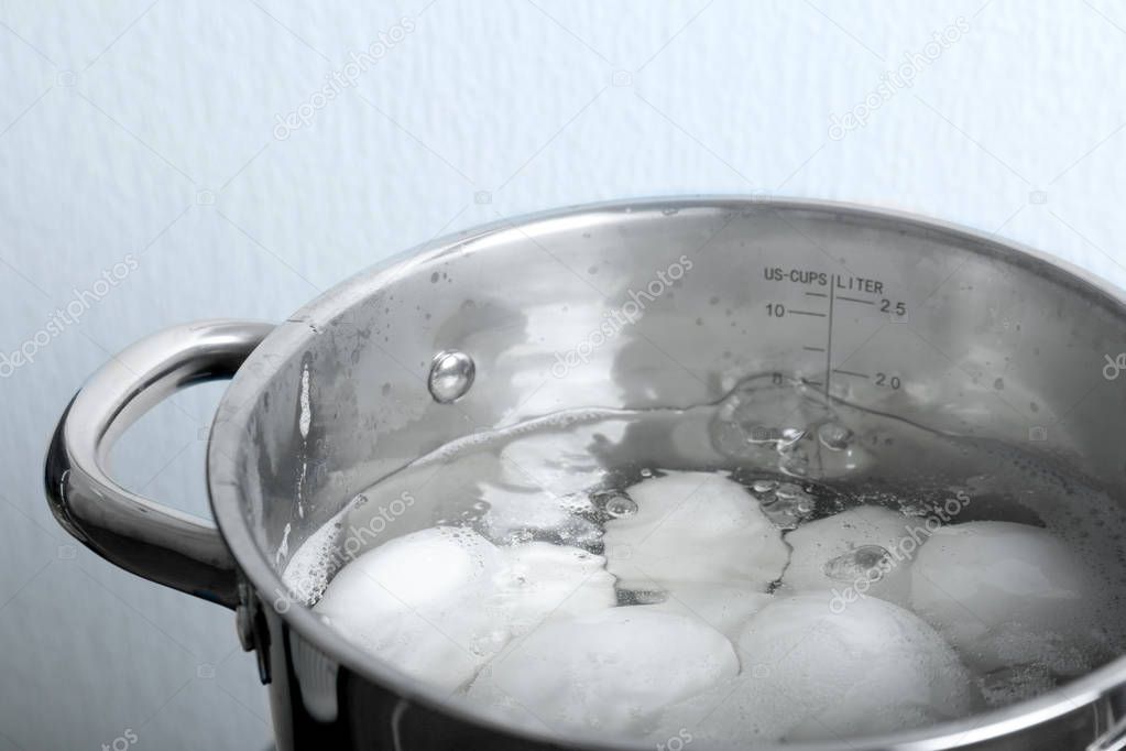 Eggs boiling in pan