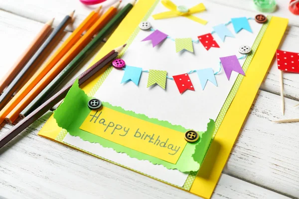 Handmade gift card and colorful crayons — Stock Photo, Image