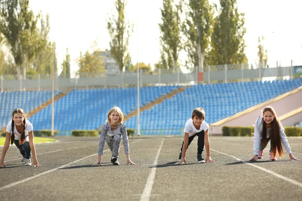 Cheerful Children Ready Position Run Track — Stock Photo, Image