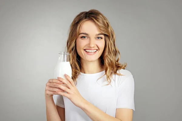 Woman with bottle of milk — Stock Photo, Image