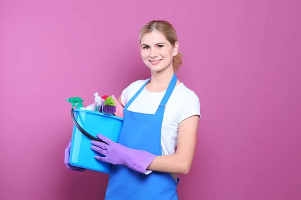 Pretty woman with cleaning supplies — Stock Photo, Image