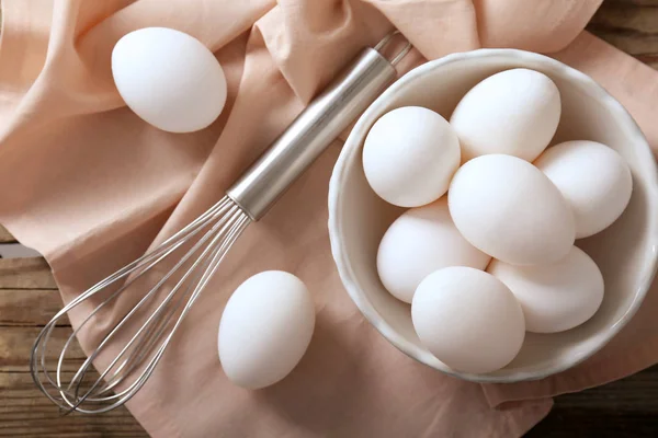 Raw eggs in bowl — Stock Photo, Image