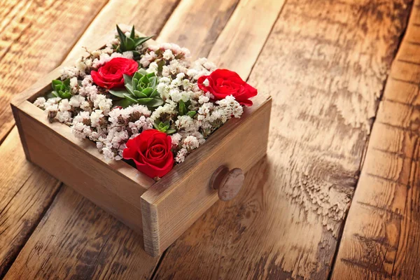 Square wooden box with beautiful flowers — Stock Photo, Image