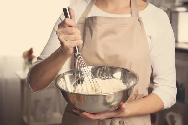 Woman holding bowl with dough — Stock Photo, Image