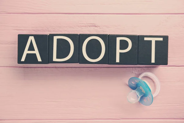 Cubos com palavra ADOPT — Fotografia de Stock