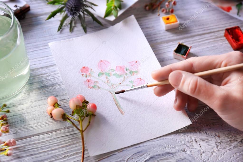 Woman drawing flower  