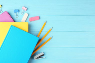 Colorful notebooks and office supplies clipart