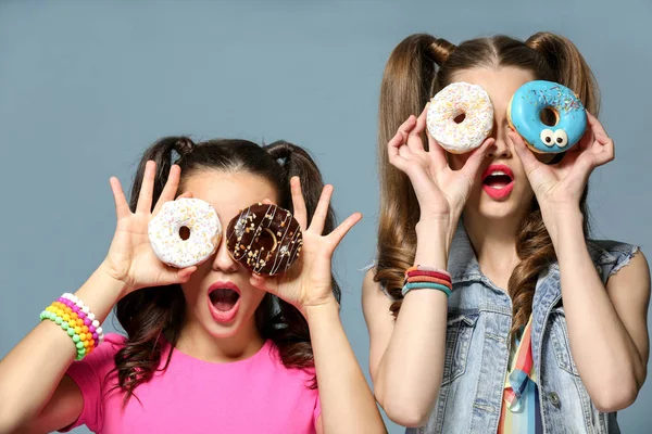 Women with tasty donuts — 스톡 사진