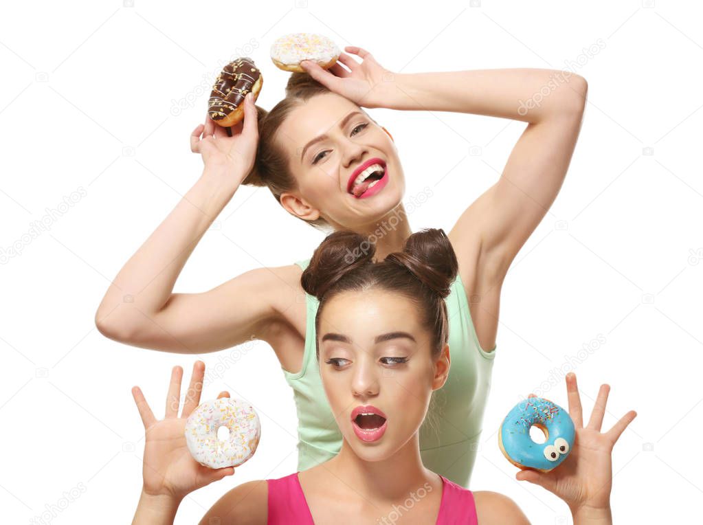 women with tasty donuts