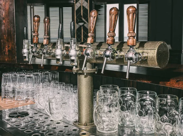 Draft beer taps in bar