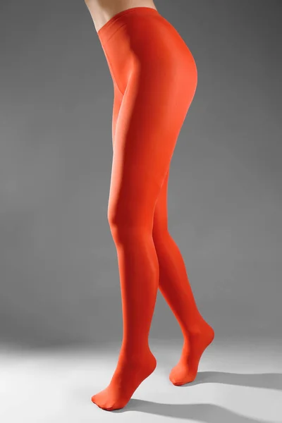 Woman legs in color tights — Stock Photo, Image