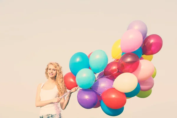 Woman with colorful balloons — Stock Photo, Image