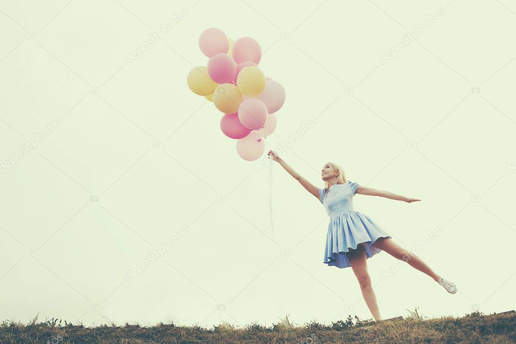 woman with colorful balloons