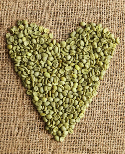 Kaffe korn på säckväv — Stockfoto