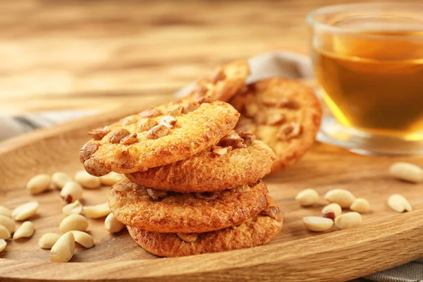 Peanut cookies with nuts and tea — Stock Photo, Image