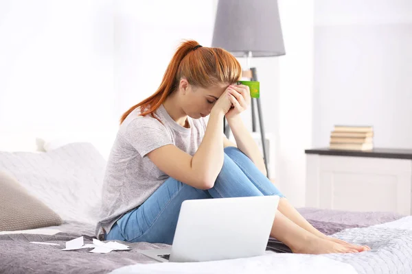 young woman calculating taxes