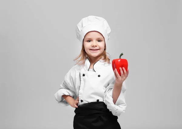 Menina bonito em uniforme chef — Fotografia de Stock