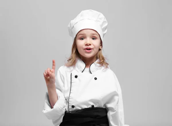 Menina bonito em uniforme chef — Fotografia de Stock