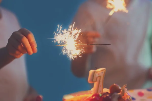 Birthday cake and child's hand — Stock Photo, Image