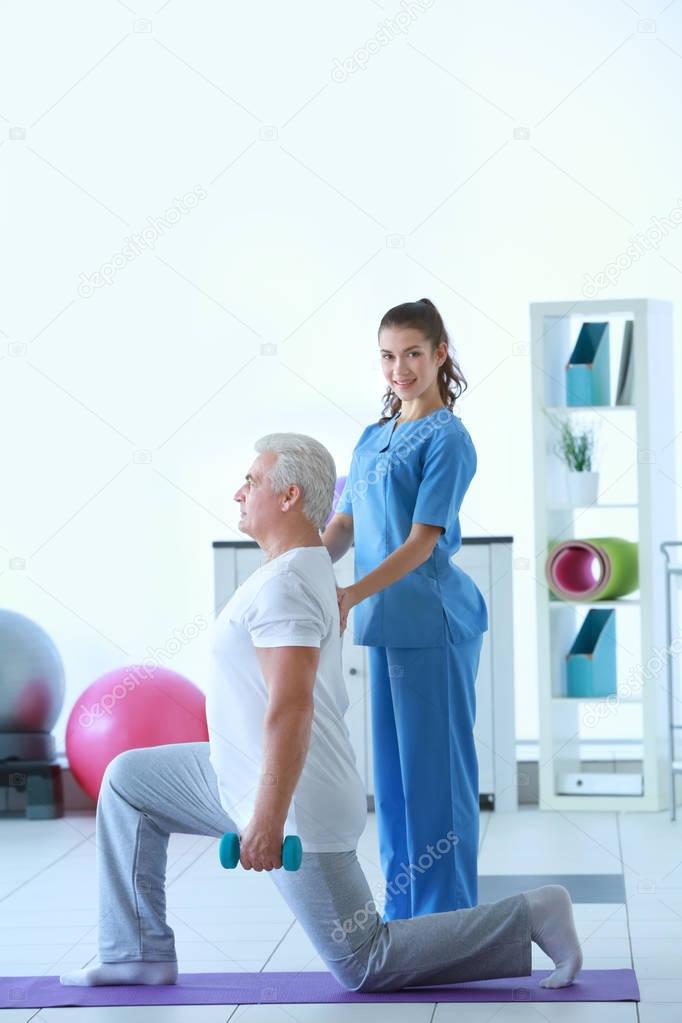 Physiotherapist working with patient 