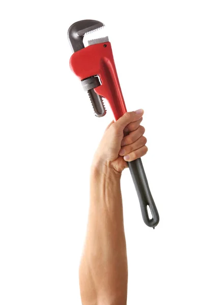 Pipe wrench in man's hand — Stockfoto