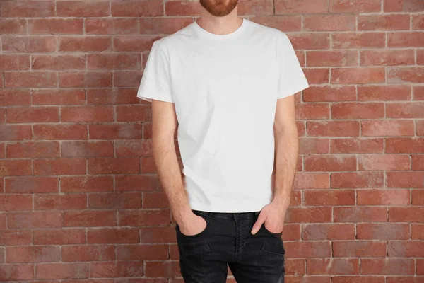 Handsome man in white T-shirt — Stock Photo, Image