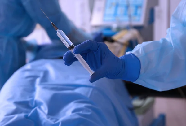 Doctor's hand with syringe — Stock Photo, Image