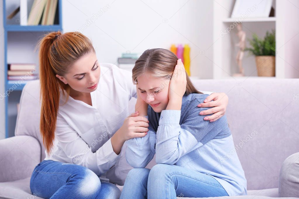 psychotherapist talking with young girl