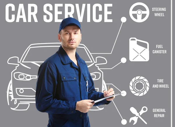 Car service concept. Young man with clipboard on gray background