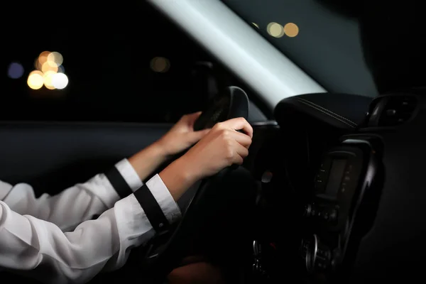 Businesswoman driving a car