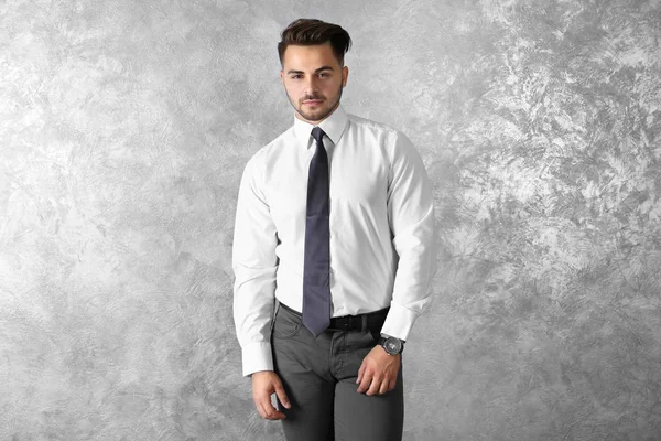 Handsome man on wall — Stock Photo, Image