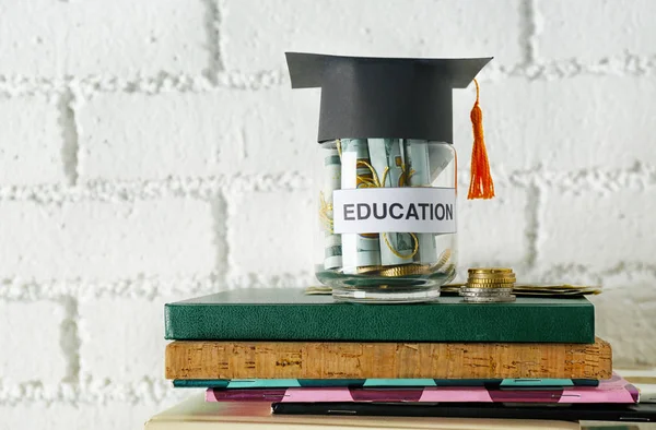 Glass jar with money for education — Stock Photo, Image