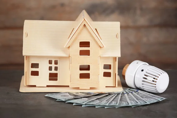 House model with money and thermostat — Stock Photo, Image