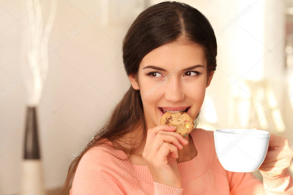 woman with tasty cookie