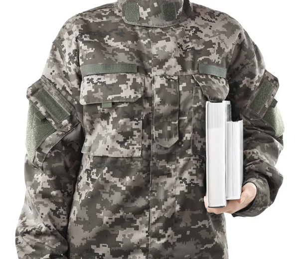 Soldier holding books — Stock Photo, Image