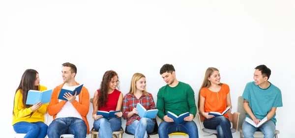 Group People Reading Books While Sitting Light Wall — Stock Photo, Image