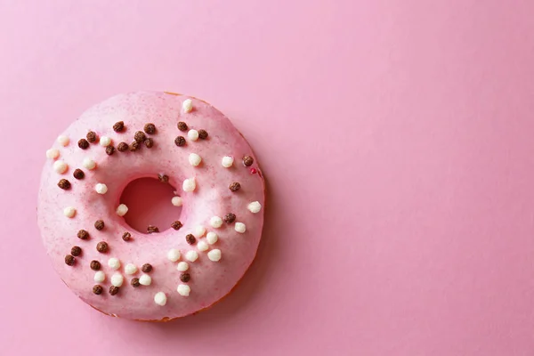 Delicious donut on pink — Stock Photo, Image