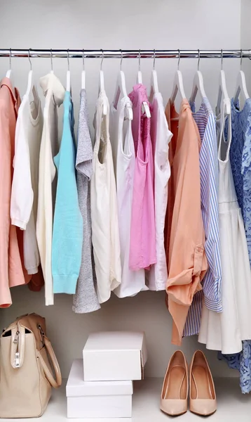 Collection of clothes on rack — Stock Photo, Image