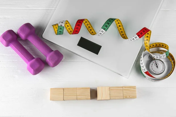 Scales and sports equipment — Stock Photo, Image