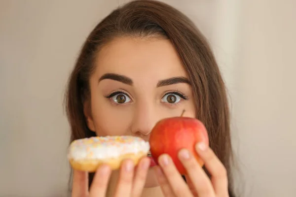 Beautiful Young Woman Making Choice Apple Donut Close — Stock Photo, Image