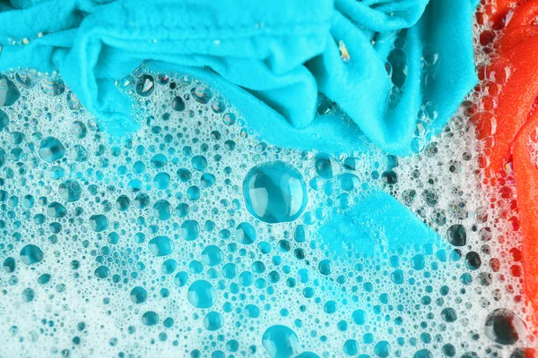 Wet color clothes with foam — Stock Photo, Image