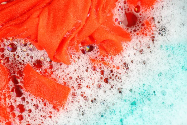 Wet color clothes with foam — Stock Photo, Image