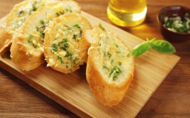 Tasty bread with garlic, cheese and herbs  clipart