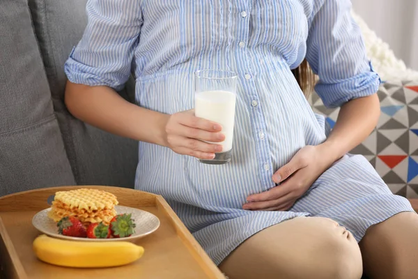 Young pregnant woman with milk — Stock Photo, Image