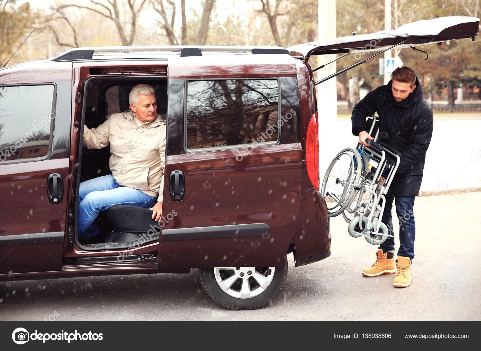 Man loading wheelchair into car Stock Photo by ©belchonock 138938606