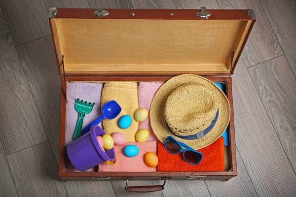 Easter eggs with open suitcase
