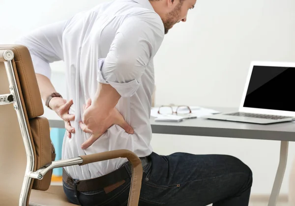 Young man suffering from backache — Stock Photo, Image