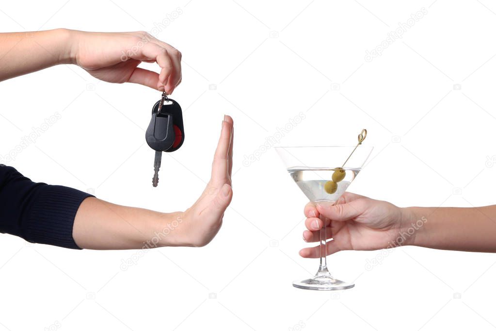 Hand of female driver refusing glass 