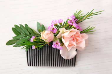 Bridal comb decorated with fresh flowers  clipart